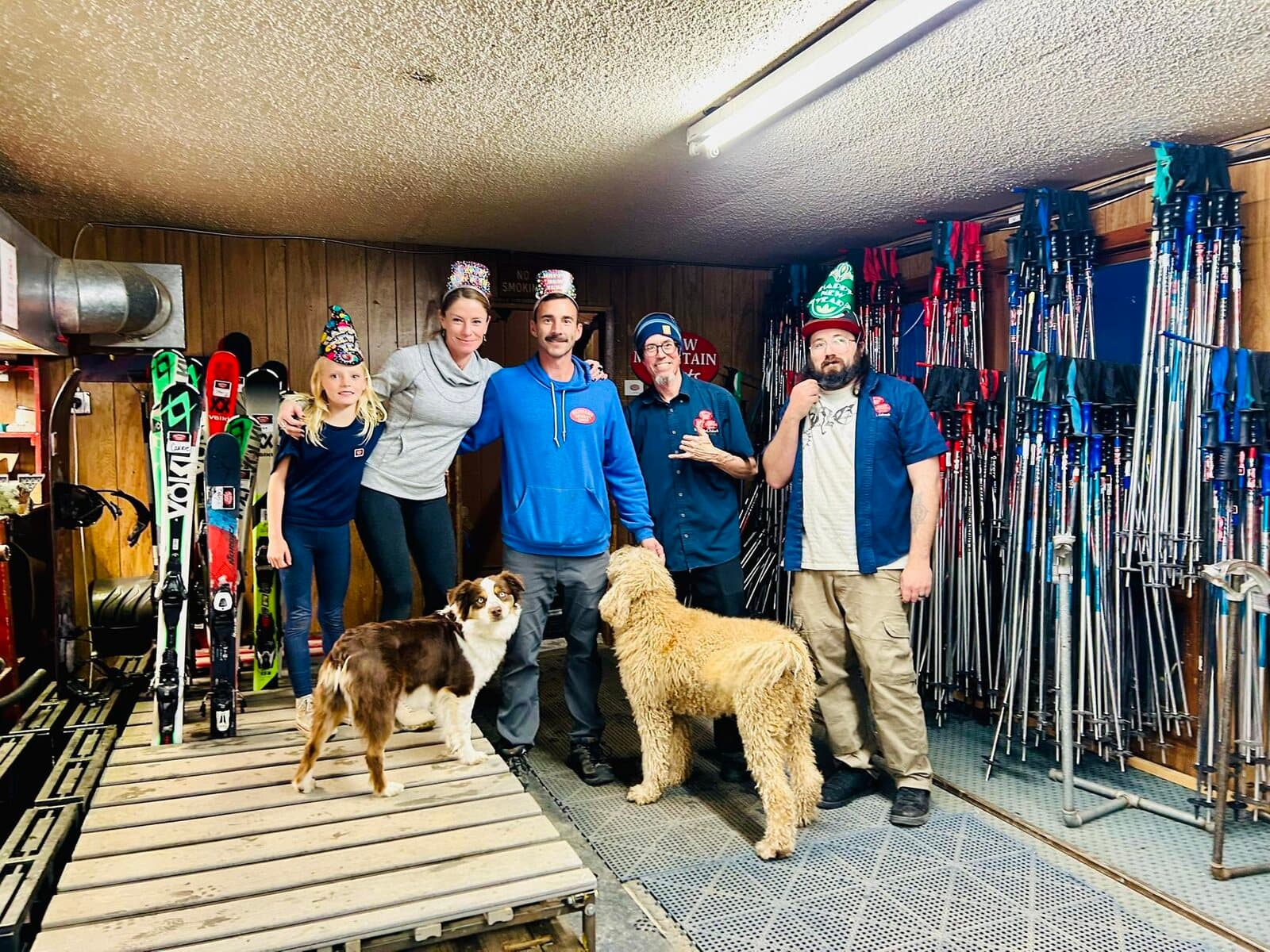 The Beavers Sports Shop crew and two shop dogs in the rental room