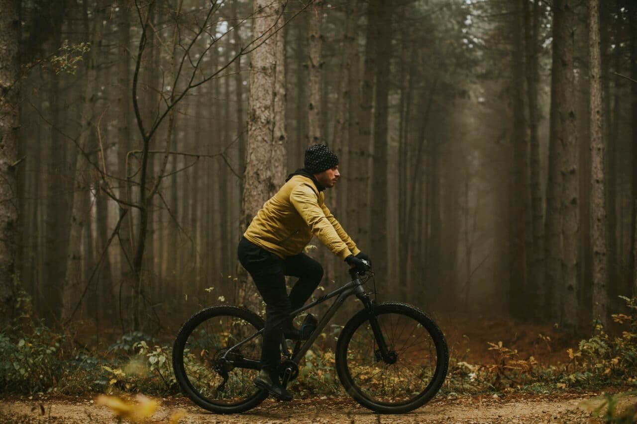Mountain biking through an autumn forest