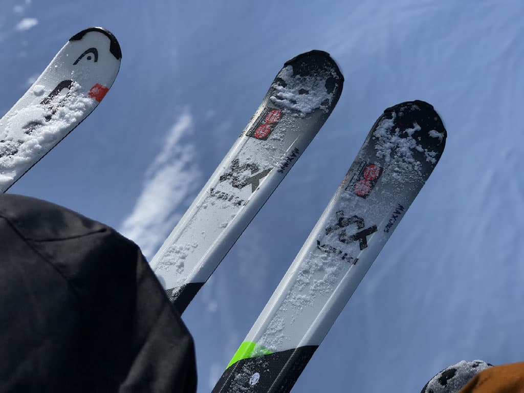 Rental skis lined up on a ski lift